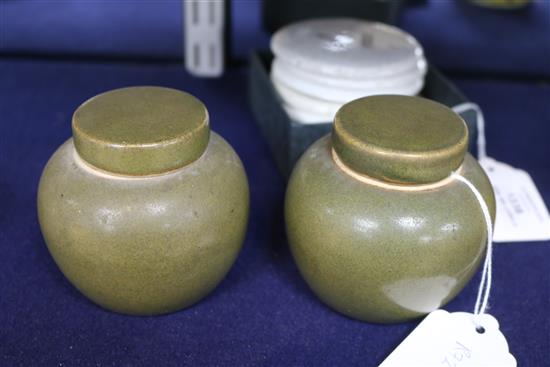 A pair of Chinese teadust glazed small jars and covers, early 20th century, 8cm high